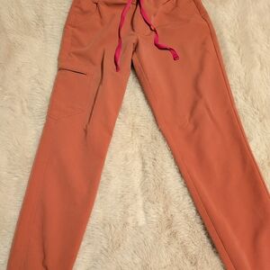 Figs Women's Zamora Joggers Scrub Pants in Rust with Pink Drawstring